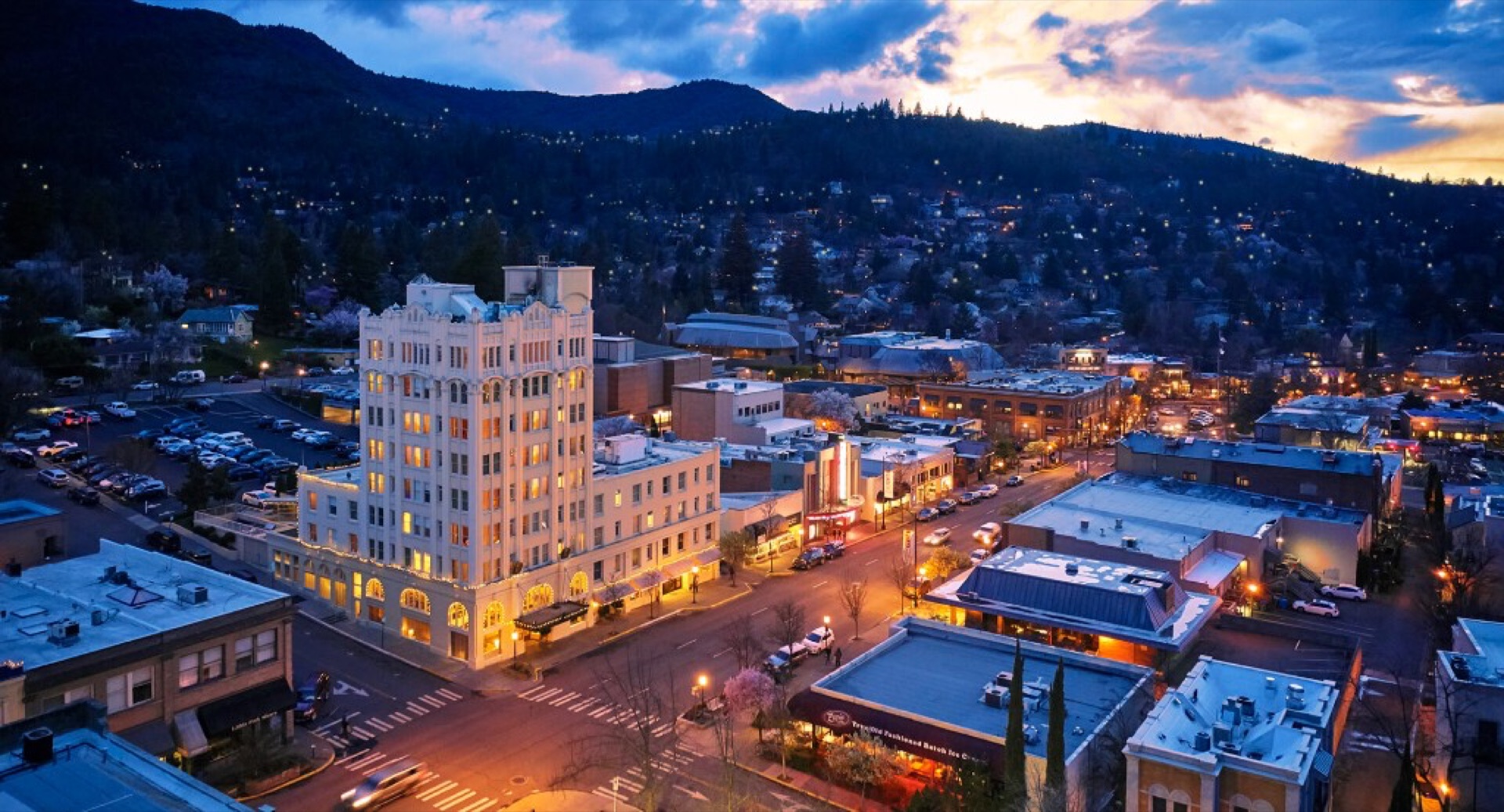 Downtown Ashland at dusk, with the Ashland Springs Hotel glowing above East Main Street